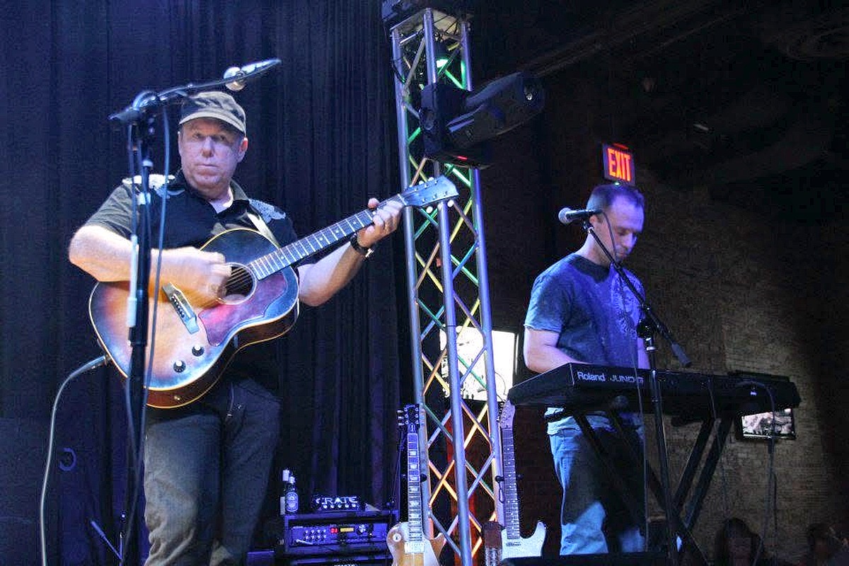 Tim Lavin performing with A Sure Thing
