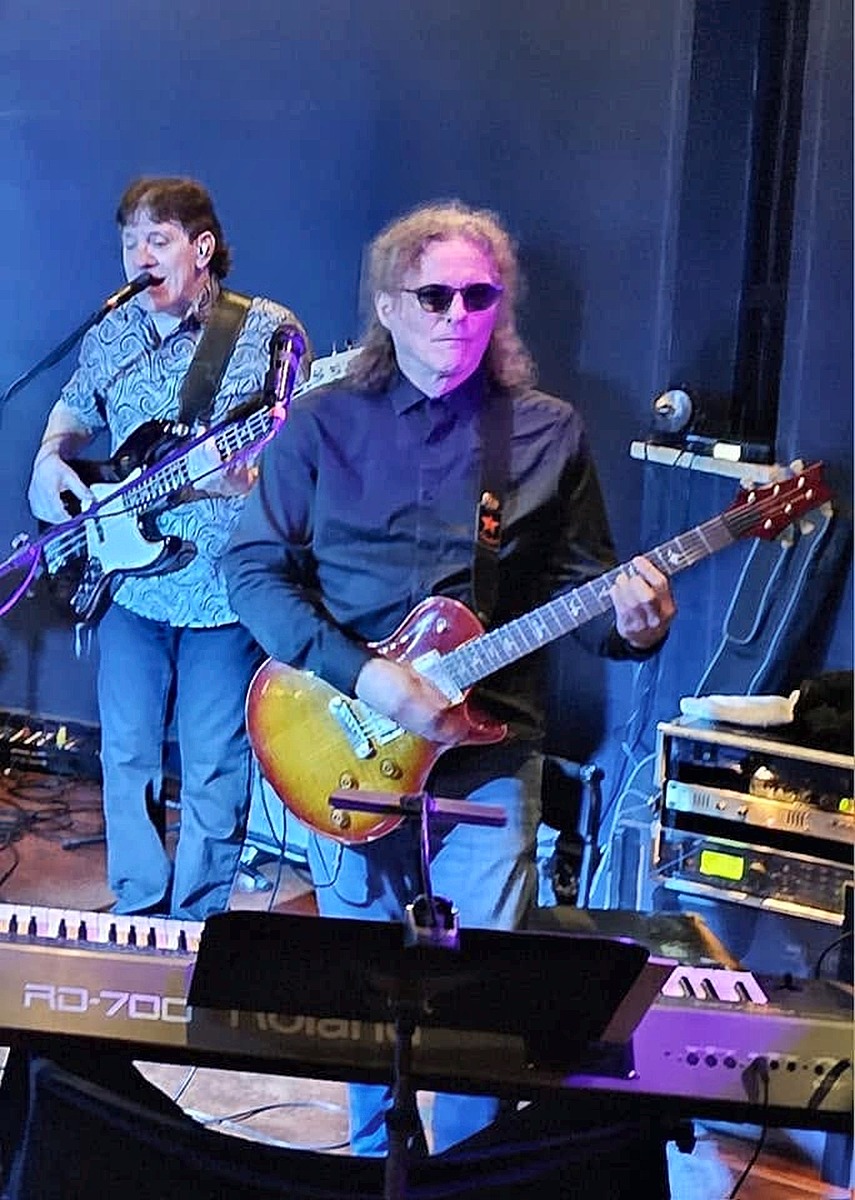 Mike Baltazar performing with A Sure Thing